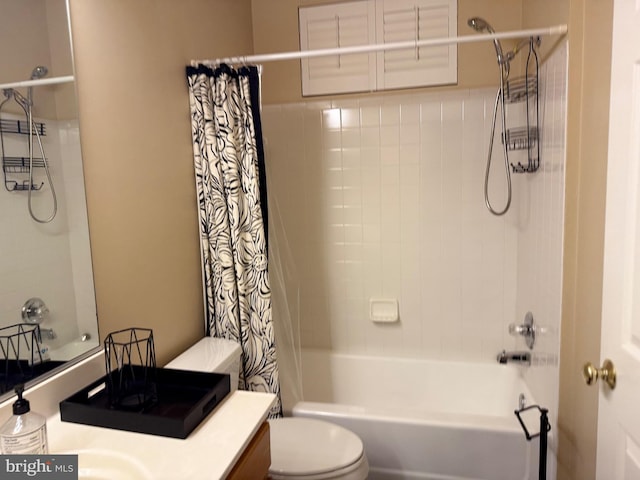 full bathroom featuring vanity, shower / tub combo, and toilet