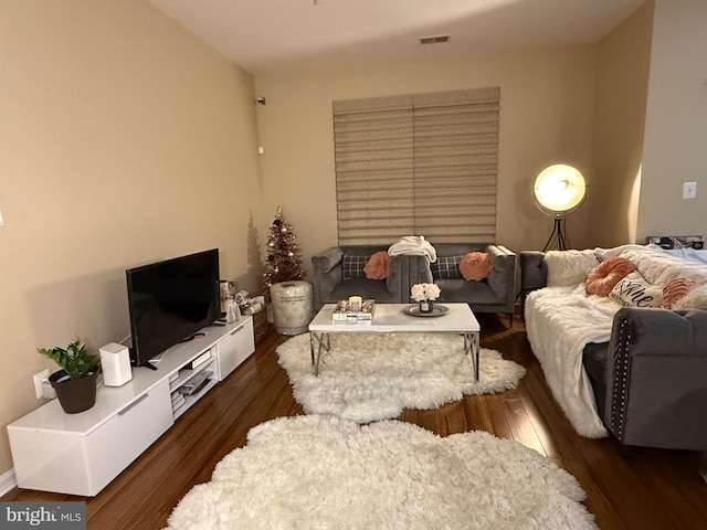 living room with dark hardwood / wood-style flooring