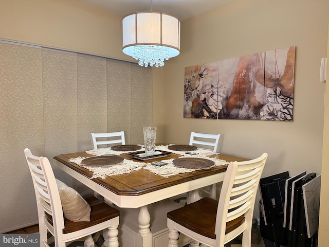 dining space featuring a notable chandelier