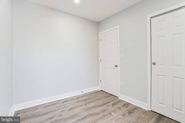 spare room with light wood-type flooring