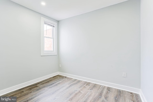 spare room featuring light hardwood / wood-style floors