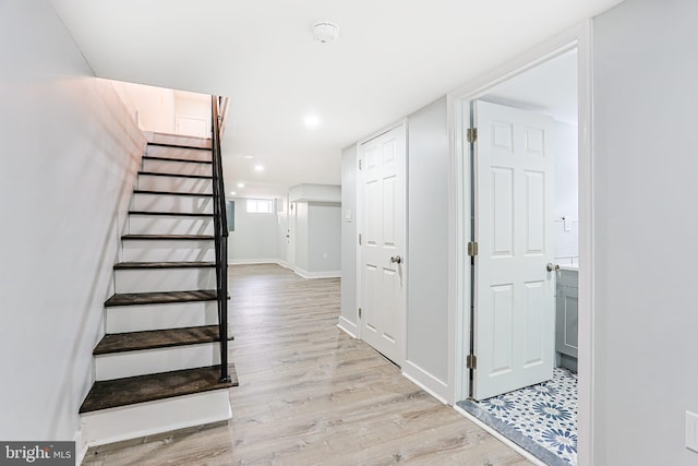 staircase featuring hardwood / wood-style floors