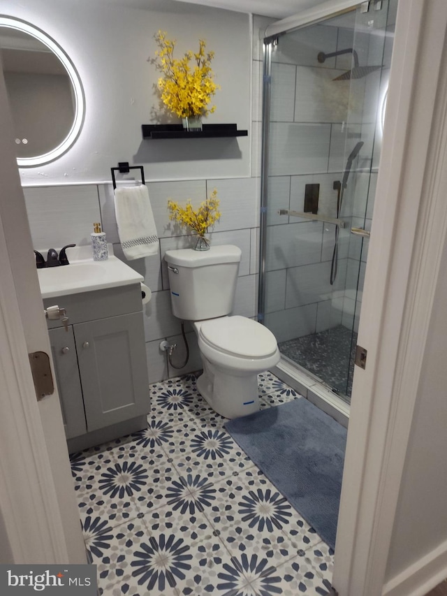 bathroom with vanity, toilet, and walk in shower