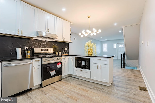 kitchen with pendant lighting, white cabinets, kitchen peninsula, stainless steel appliances, and light hardwood / wood-style flooring