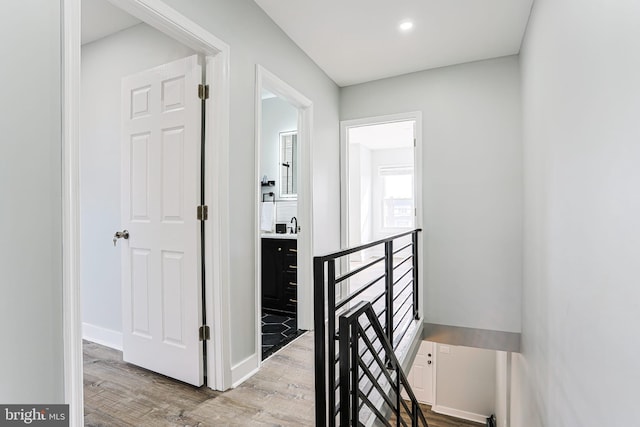 hall with light hardwood / wood-style flooring