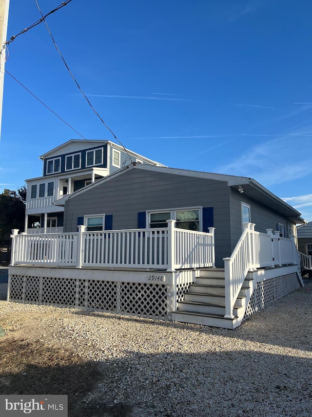 view of front of house featuring a wooden deck