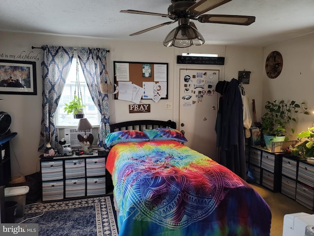 bedroom featuring cooling unit and ceiling fan