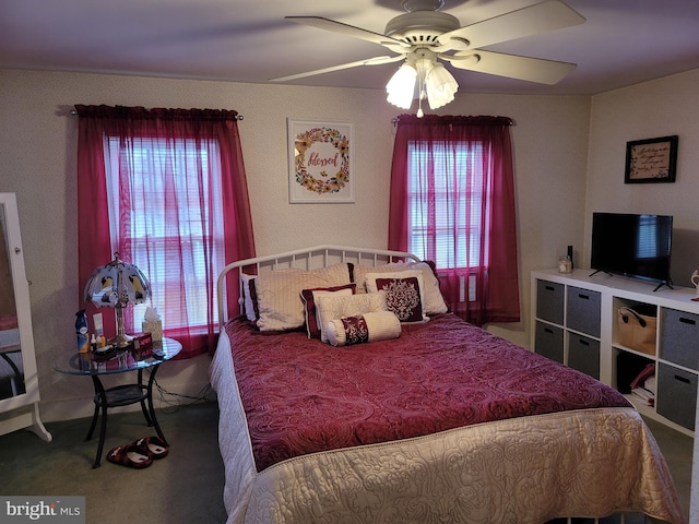 bedroom with ceiling fan and carpet flooring