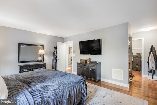 bedroom with hardwood / wood-style flooring