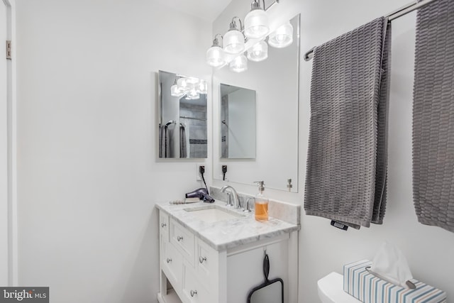 bathroom featuring vanity, toilet, and a shower with shower curtain