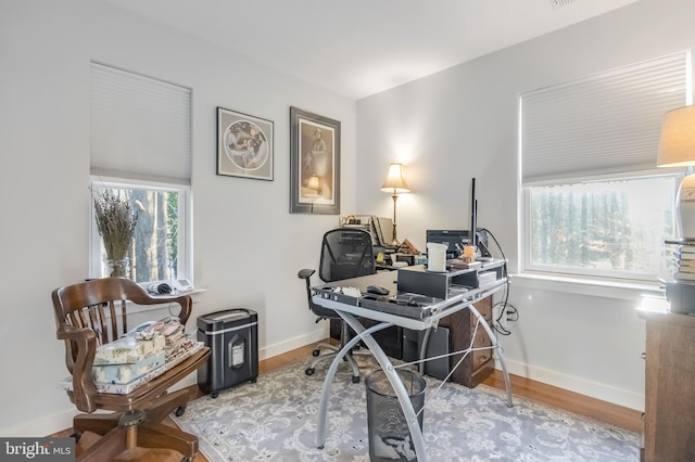 office with hardwood / wood-style flooring