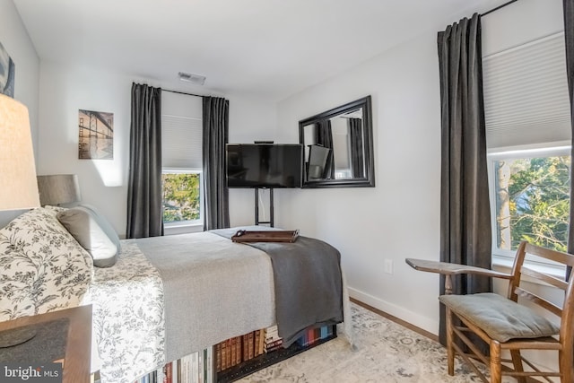 bedroom featuring wood-type flooring