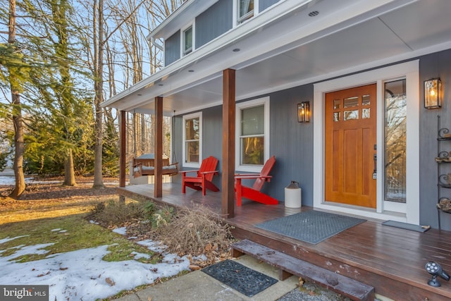 entrance to property featuring covered porch