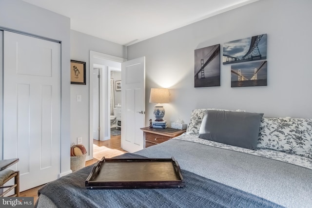 bedroom with hardwood / wood-style flooring