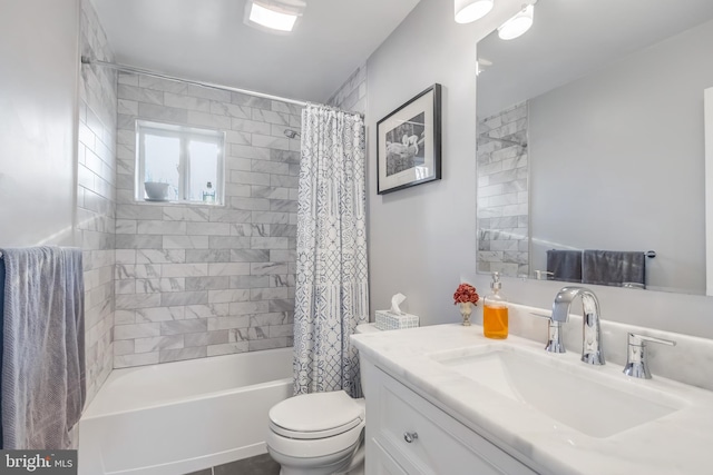 full bathroom with vanity, shower / tub combo, and toilet