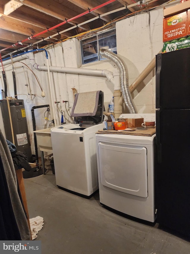 laundry room with separate washer and dryer, electric water heater, and sink