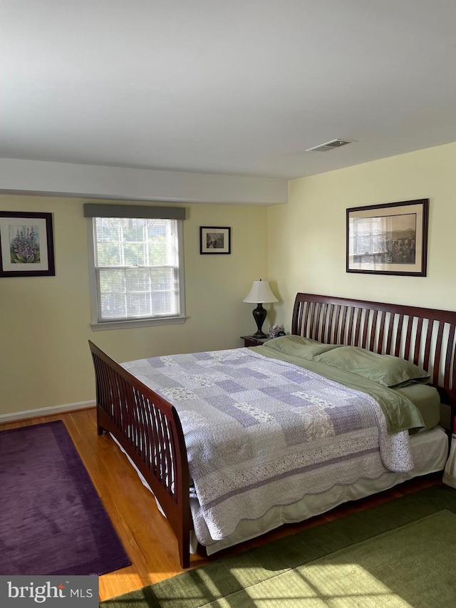 bedroom featuring hardwood / wood-style floors