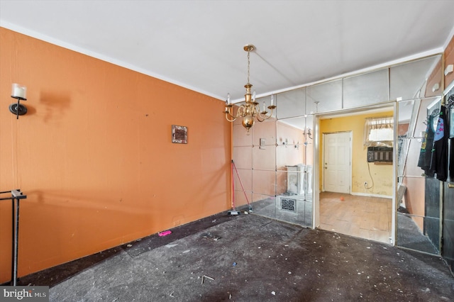 unfurnished dining area with a chandelier