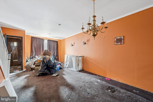 unfurnished dining area featuring an inviting chandelier and ornamental molding