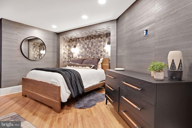 bedroom featuring light wood-type flooring and recessed lighting