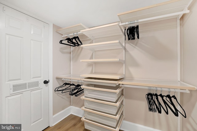 spacious closet with wood finished floors