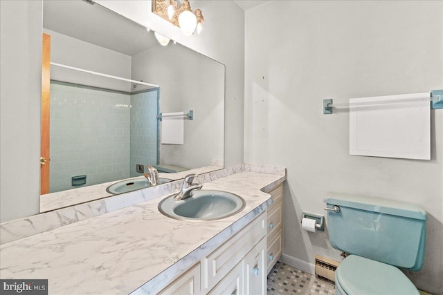 full bathroom with a shower, a baseboard radiator, toilet, vanity, and baseboards