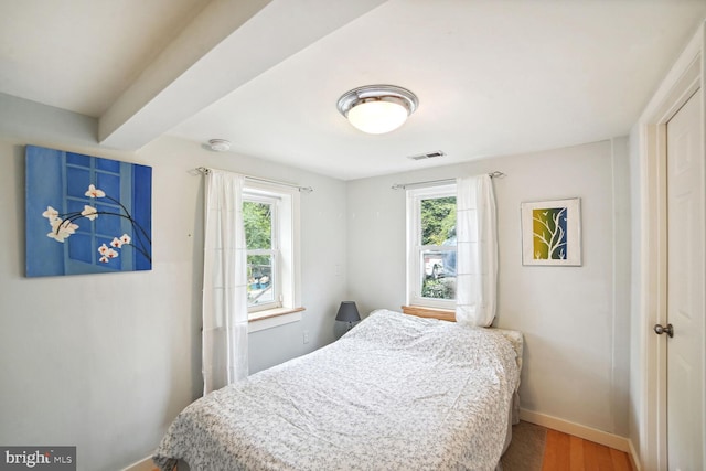 bedroom with wood-type flooring