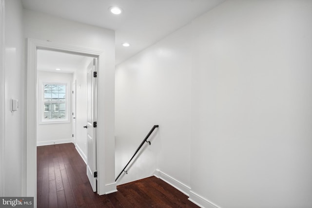 corridor featuring dark hardwood / wood-style flooring