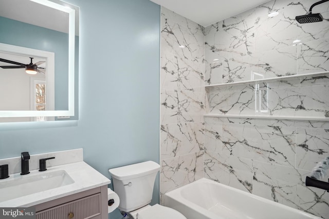 full bathroom with vanity, ceiling fan, toilet, and tiled shower / bath