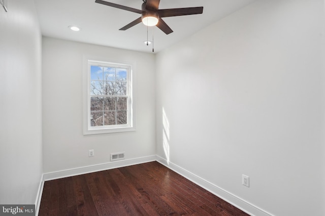 unfurnished room with dark wood-type flooring and ceiling fan