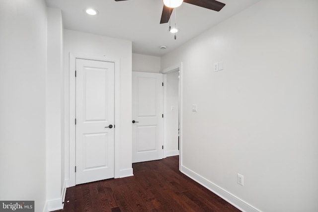 hall with dark wood-type flooring