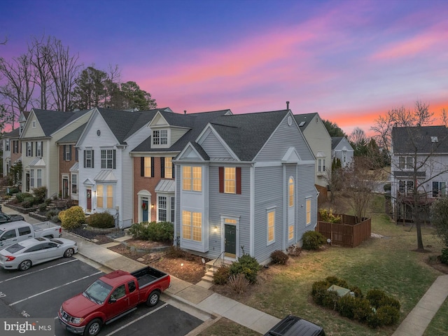 view of front of property with a yard