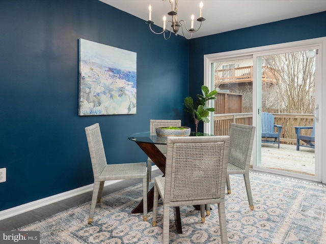 dining space featuring an inviting chandelier