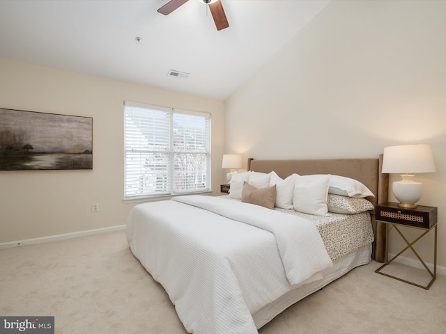 bedroom with light carpet, lofted ceiling, and ceiling fan