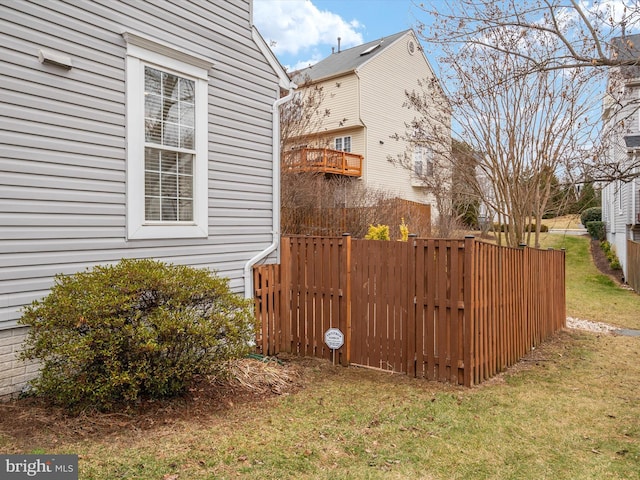 view of side of home with a lawn