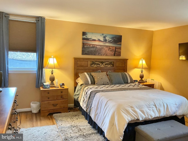 bedroom with light hardwood / wood-style floors