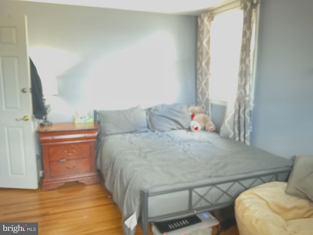 bedroom featuring light wood-type flooring