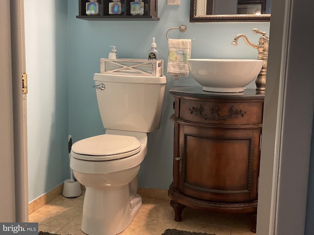 bathroom with vanity, tile patterned floors, and toilet