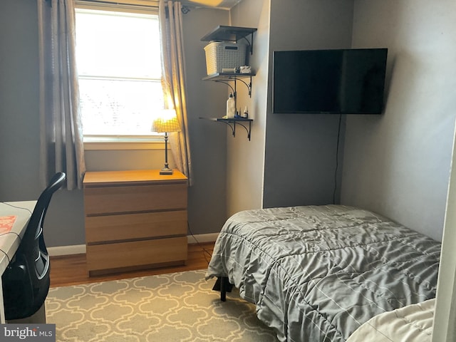 bedroom with light hardwood / wood-style flooring