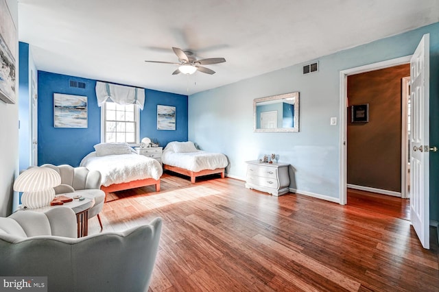 bedroom with hardwood / wood-style floors and ceiling fan