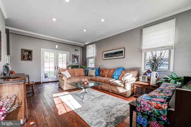 living room with ornamental molding, hardwood / wood-style floors, and french doors