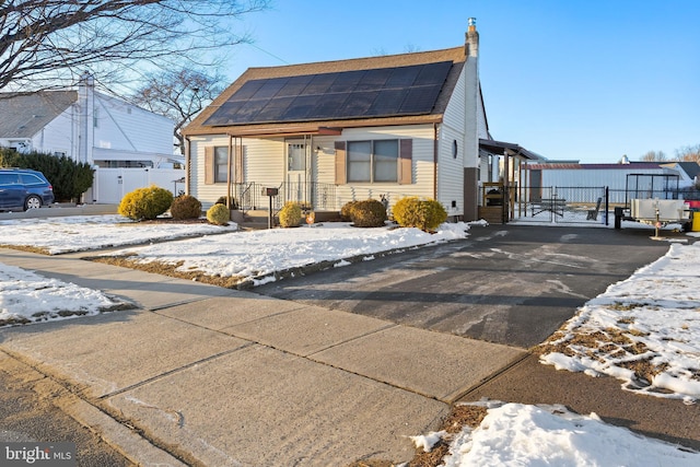 bungalow featuring solar panels