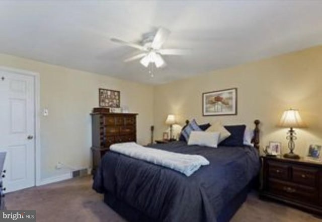 carpeted bedroom with ceiling fan