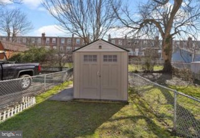 view of outbuilding with a lawn