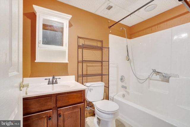 full bathroom with vanity, toilet, and washtub / shower combination