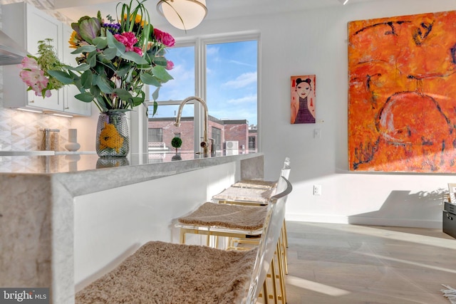 interior space with tasteful backsplash and hardwood / wood-style floors