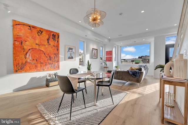 dining area featuring light wood-type flooring