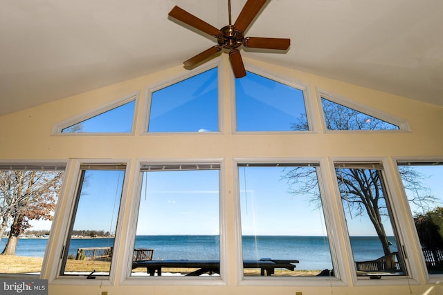 interior space featuring vaulted ceiling, a water view, plenty of natural light, and ceiling fan