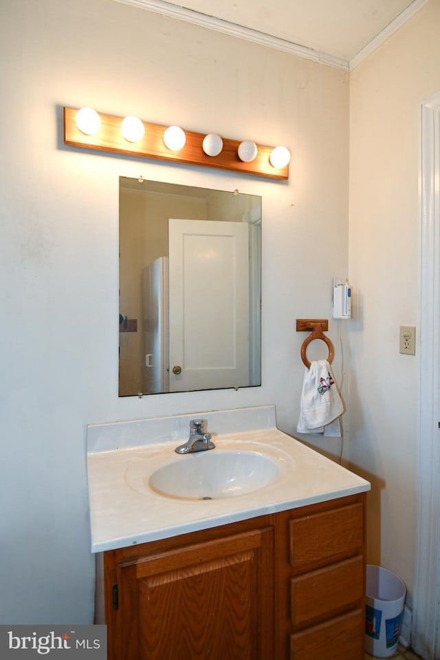 bathroom featuring vanity and crown molding