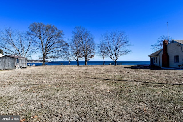 view of yard with a water view